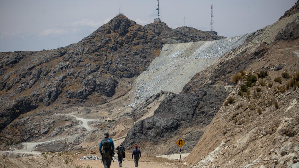 Men walk near the mine in Peru