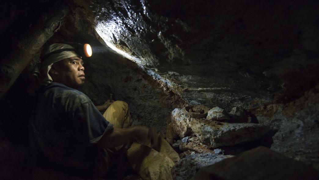 Gold miner inside shaft in the Philippines 