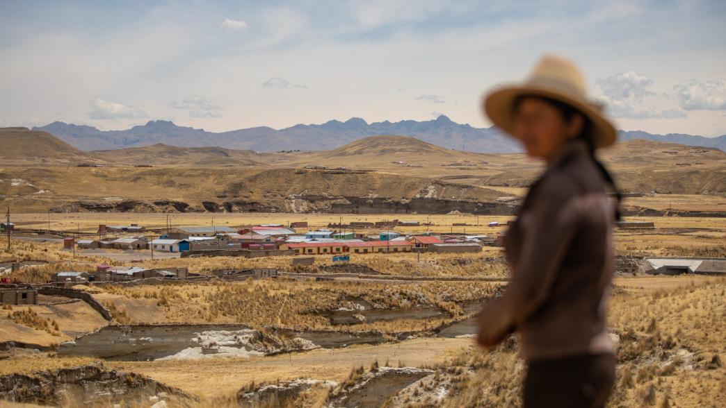 Woman in Peru overlooking a mine