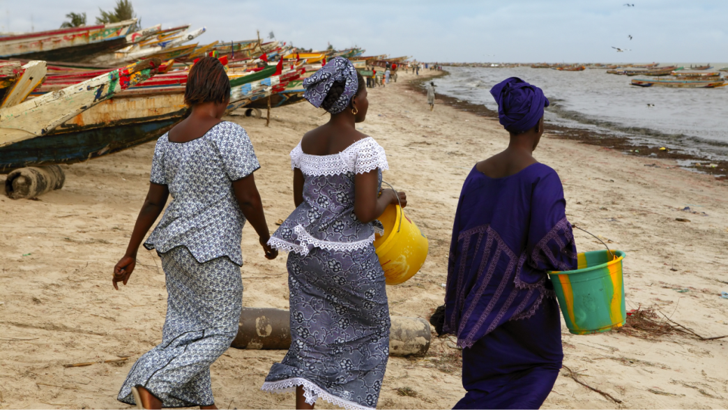 Women walking on beach in Senegal