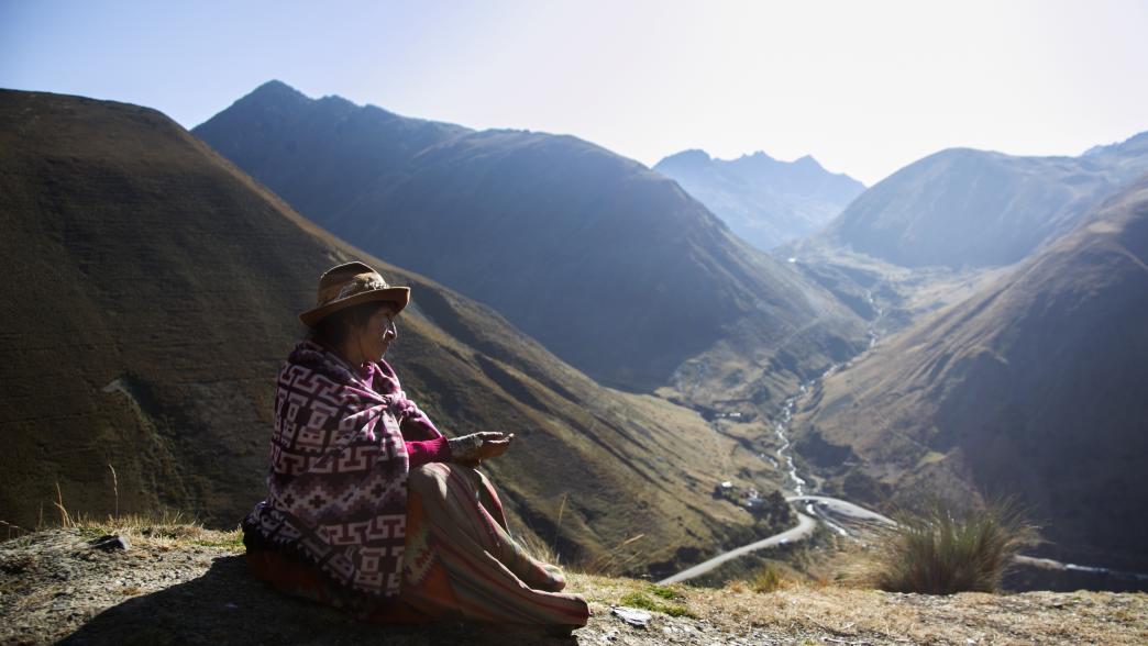 Woman in Peru sitting on mountain