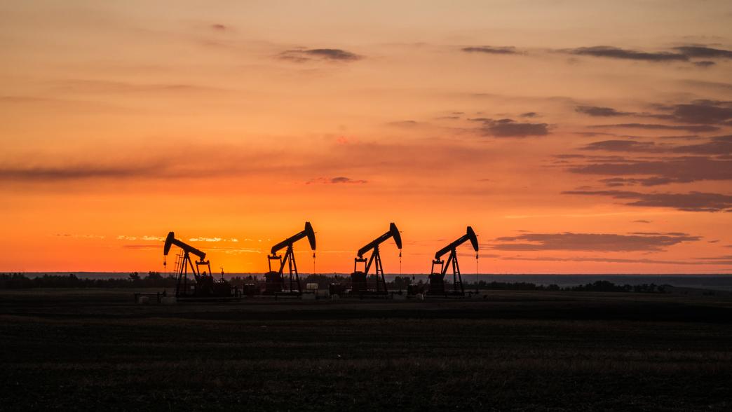 Oil rigs at sunset
