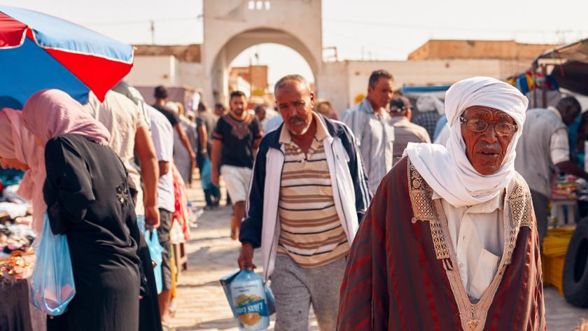 Men in traditional Tunisian clothes in Douz market, Tunisia