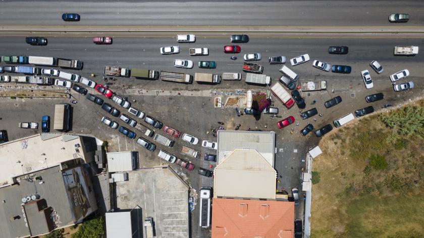 Tens of cars line up near the very few open gas stations in Lebanon - stock photo Tens of cars line up near the very few open gas stations in Lebanon. Drivers wait for hours due to fuel shortage