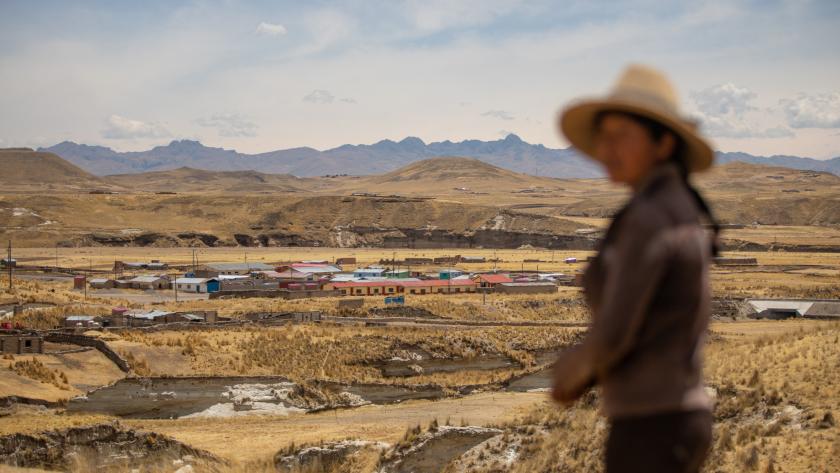 Woman in Peru overlooking a mine