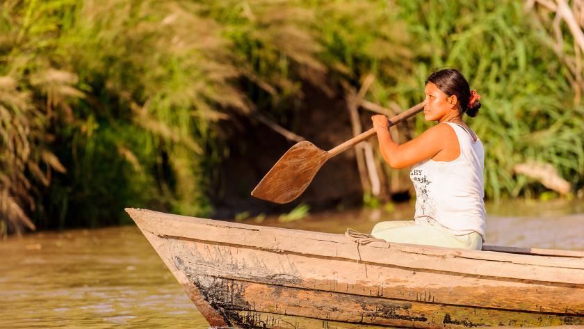 Woman on boat in the Amazon in Peru