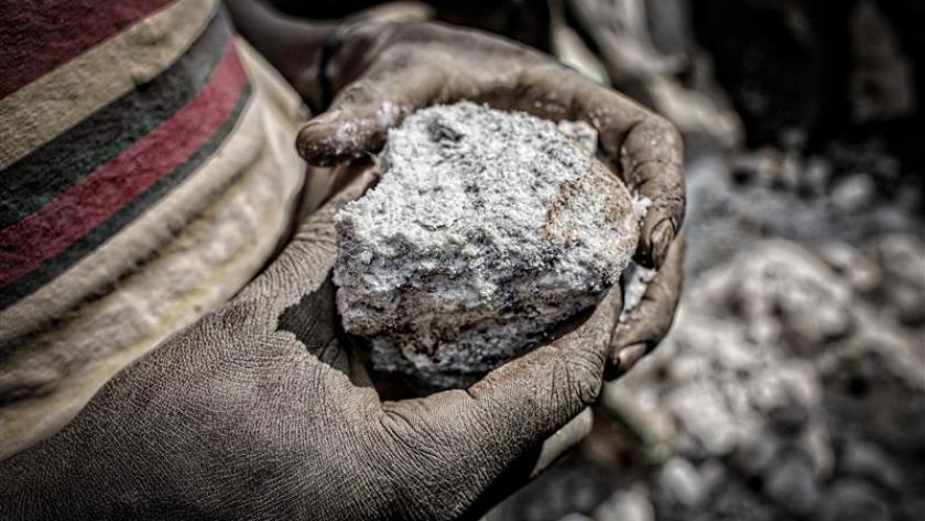 Person holding minerals