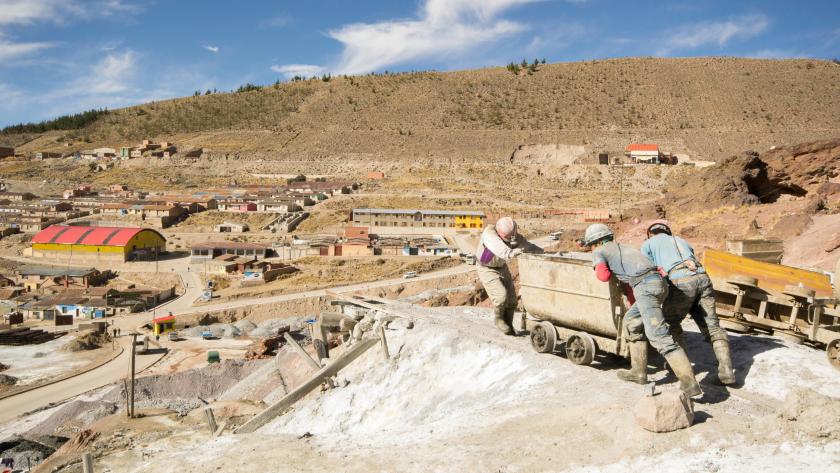 Miners pushing cart in Bolivia