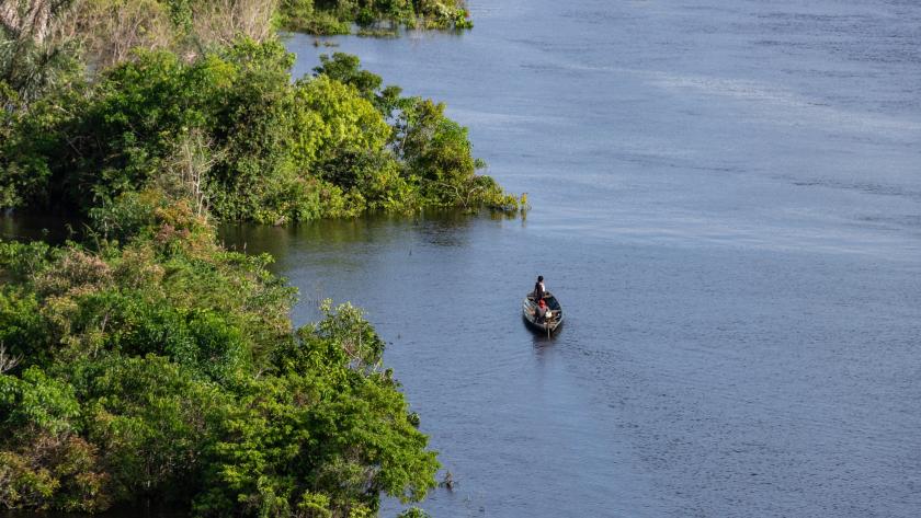 Boat on river with two people