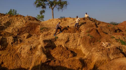 Villagers working at a gold mine in Uganda