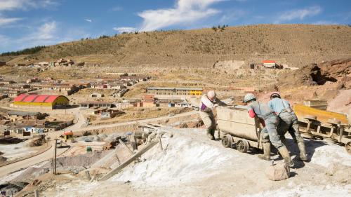 Miners pushing a cart in Bolivia