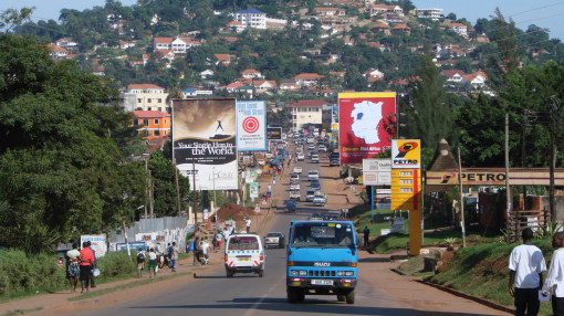 Busy road with petrol station in the background, Uganda