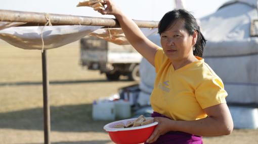 Woman with a bucket in Mongolia