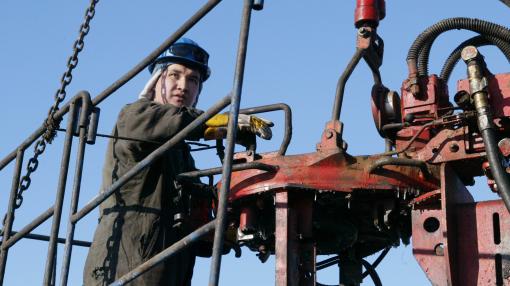 A worker services an oil well in Kyzylorda, Kazakhstan