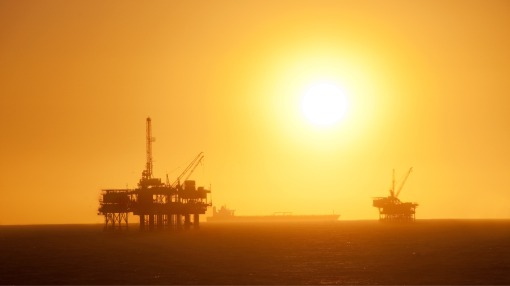 Oil rigs at sunset in the sea