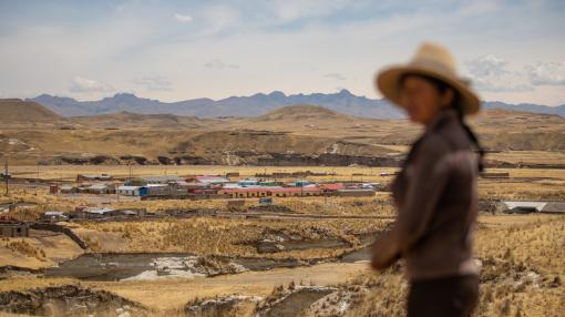 Woman in Peru overlooking a mine
