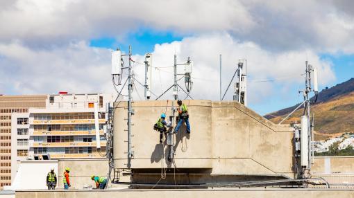 Electrical workers repairing a telecommunications tower
