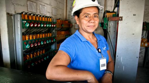 Female mexican miner in white hard hat