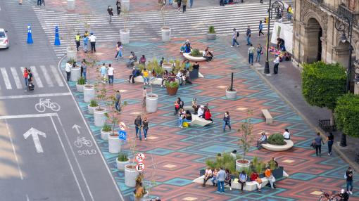 edestrians Sitting on Benches and Walking Near Zocalo Square in Mexico City