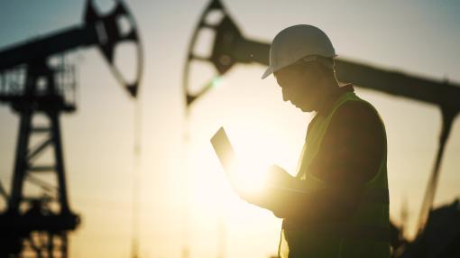 engineer next to an oil rig