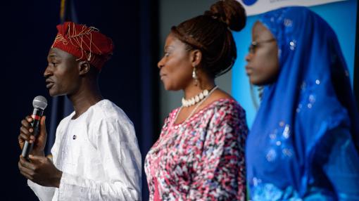 Three people on stage