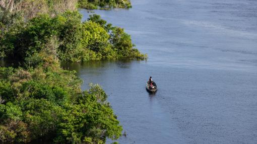 Boat on river with two people