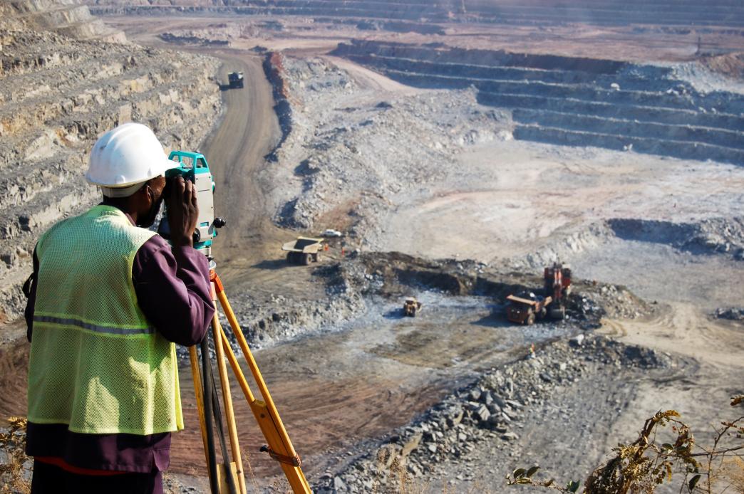 Surveyor at an open-pit copper mine in Zambia