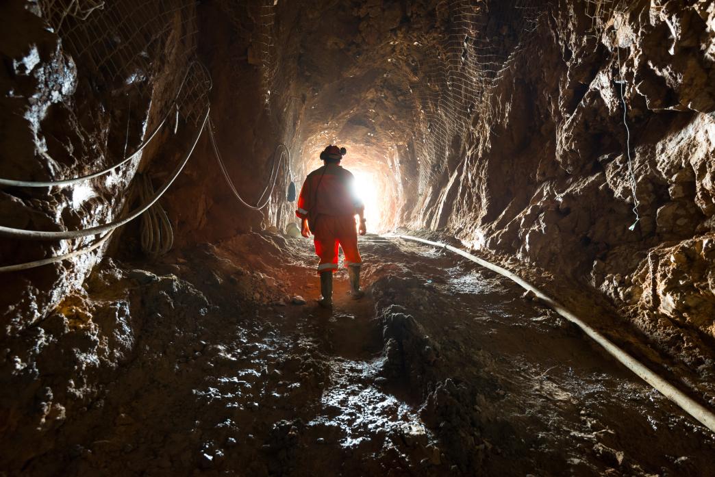 Region del Maule, Chile - Miner inside the access tunnel of an underground gold and copper mine.