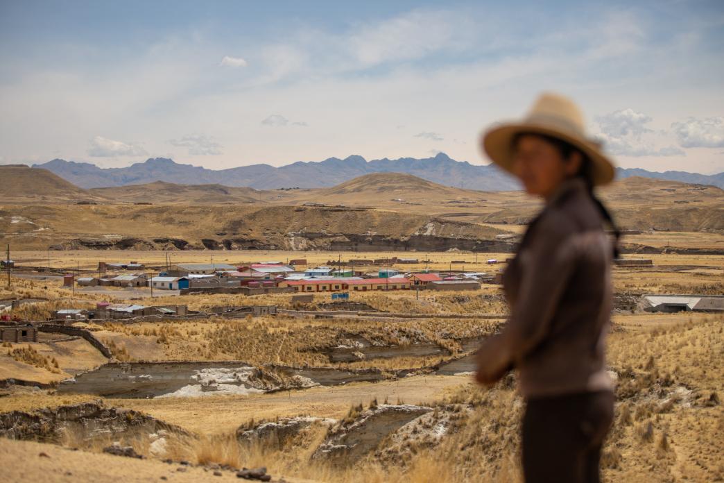 Woman in Peru overlooking a mine