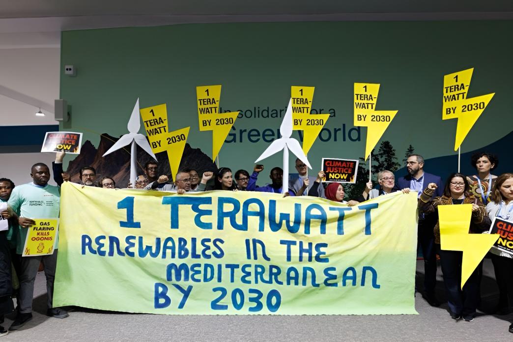 Activists in Baku at COP29 promoting renewable energy in the Mediterranean region