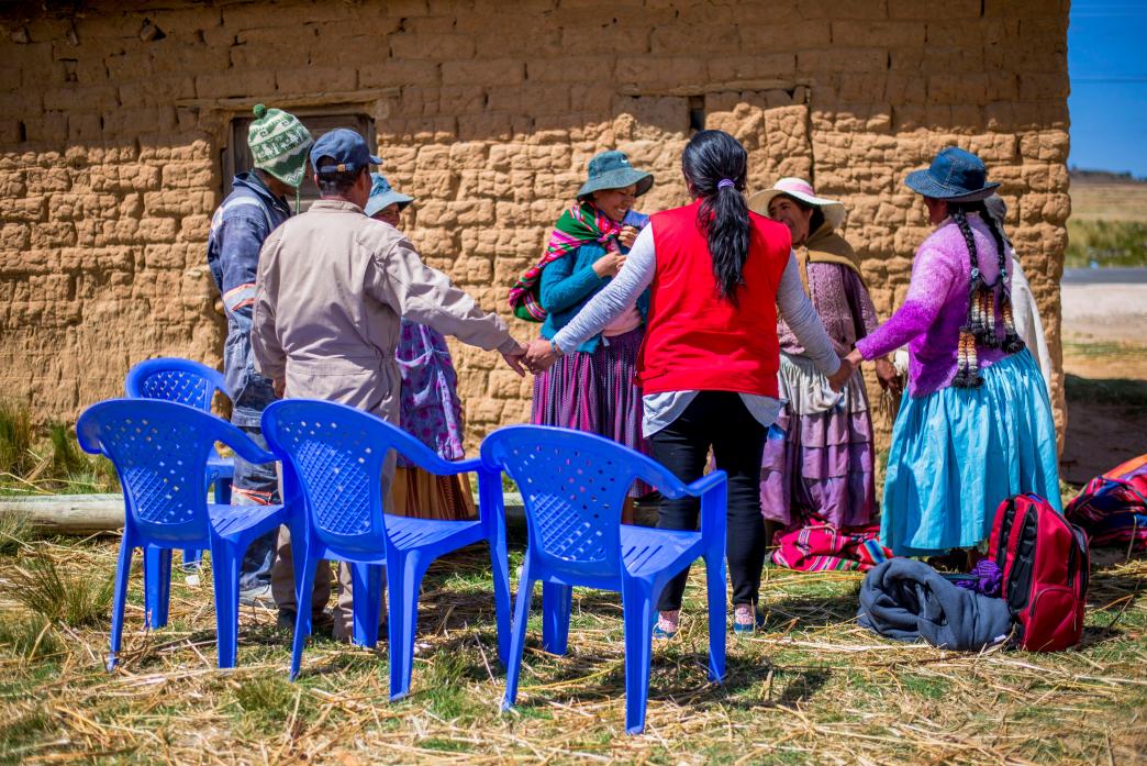 Aymara community members in Ollajtay, La Paz, discuss local issues